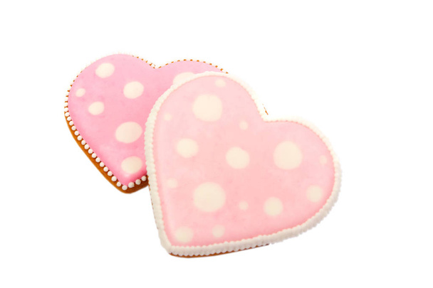 Background from pink cookies heart shaped with different patterns, isolated - Фото, изображение