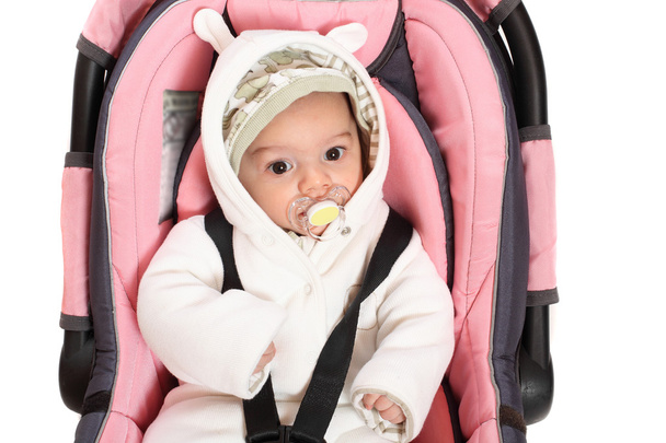 Baby in safety seat. Safety and insurance concept - Photo, Image