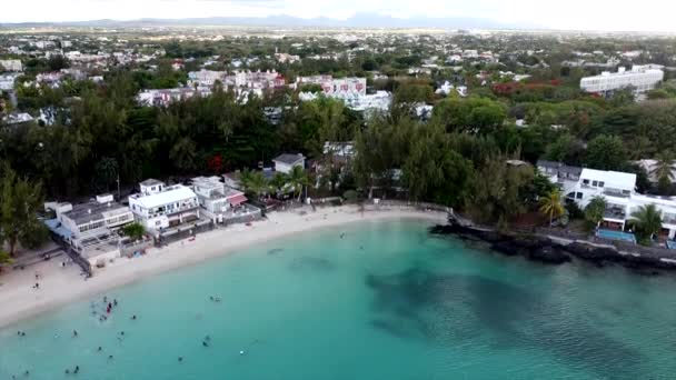 Landing drone shot of tropical blue bay lagoon with sandy beach at shore - Video