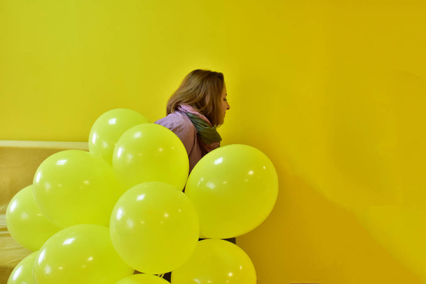 beautiful woman with yellow balls - Photo, Image
