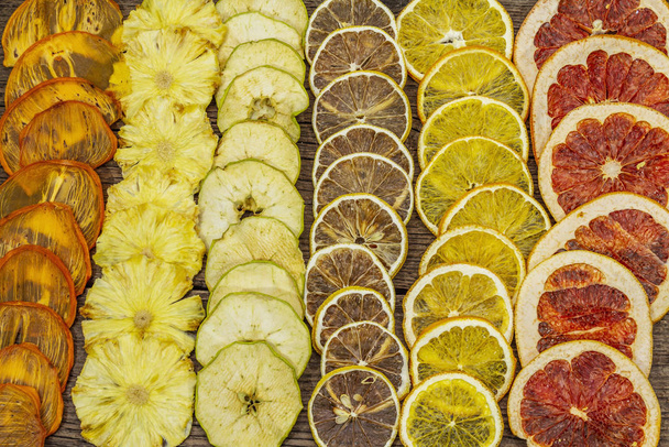Assorted dried fruits. Healthy eating concept. Old wooden boards background - Photo, Image