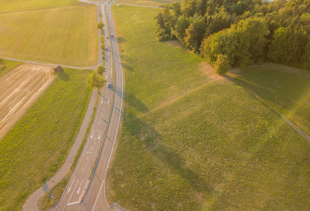 Aerial view of road in rural area during sunset in Switzerland - Foto, Imagem