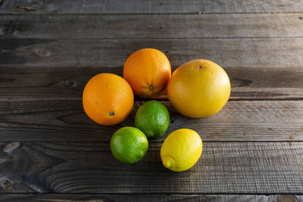 Oranges, grapefruit, limes and lemon - Фото, зображення