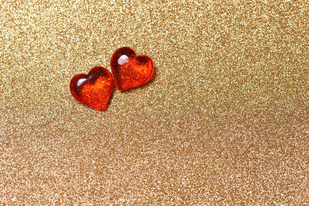 Two red hearts on the gold background, love concept for Valentine's Day - Photo, image
