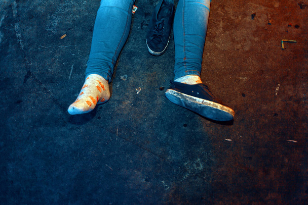 the detail on the shoes and feet of a collapsed girl after a party - Photo, Image