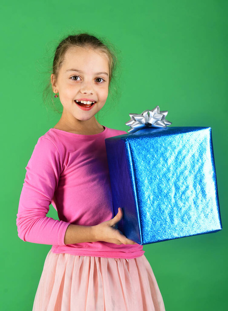 New Year presents concept. Lady holds blue gift for Christmas. - Photo, Image
