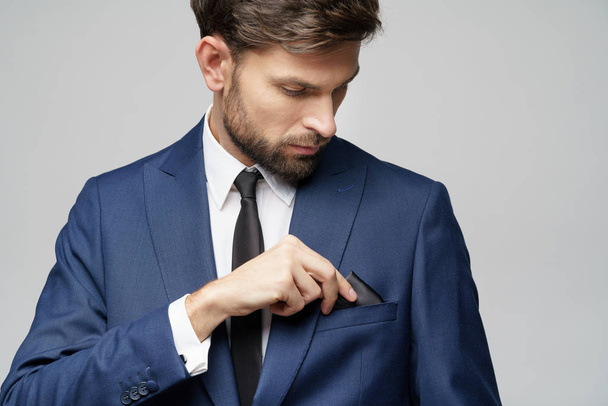 studio photo of young handsome stylish businessman wearing suit - Fotografie, Obrázek