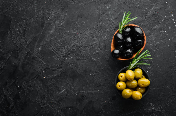 Colored olives in a bowl. Top view. Free space for your text. - Фото, изображение