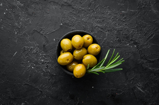 Green olives in a bowl. Top view. Free space for your text. - Fotoğraf, Görsel