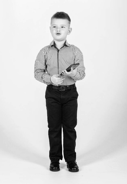small boy with mobile phone. little boss. Ceo direstor. childhood. Business communication. confident child has business start up. Businessman. Office life. Conversation. Responding on business e-mail - Photo, image