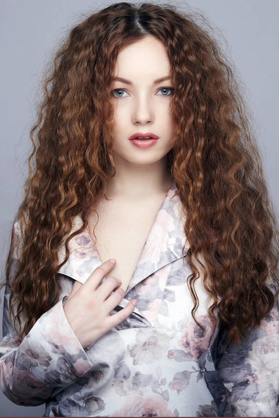beautiful young woman with curly hair - Zdjęcie, obraz