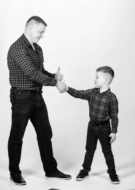 Father example of noble human. Cool guys. Father little son red shirts family look outfit. Best friends forever. Happiness being father of boy. Dad and adorable child. Parenthood concept. Fathers day - Photo, image