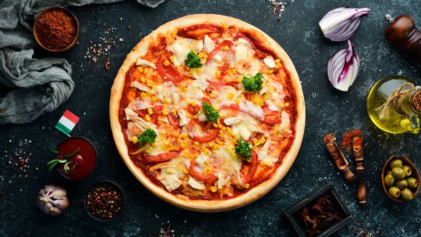 Homemade pizza with chicken, tomatoes and corn. Top view. free space for your text. Rustic style. - Foto, imagen