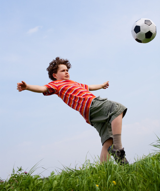 Boy playing football - Foto, Imagen