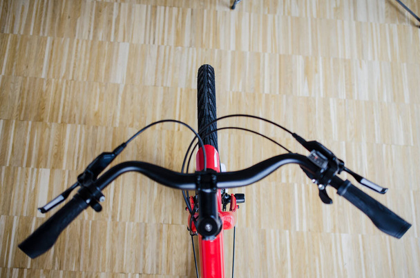 Close up of handlebar of bicycle in top view from above - Photo, Image