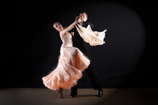Latino dancers in ballroom isolated on black - Foto, afbeelding