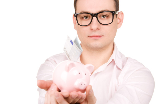 Businessman with piggy bank and money - Foto, Bild