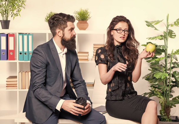 Office lunch. Man and woman conversation during lunch time. Office rumors. Couple coworkers relax lunch break. Share lunch with with colleague. Flirting colleagues. Bearded man and attractive woman - Foto, Imagem