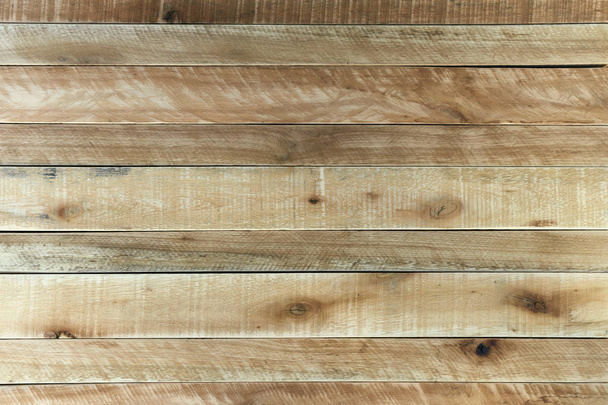 Rustic light brown wooden background. Wood textured surface made with Pine and Eucalyptus boards and slats. - 写真・画像