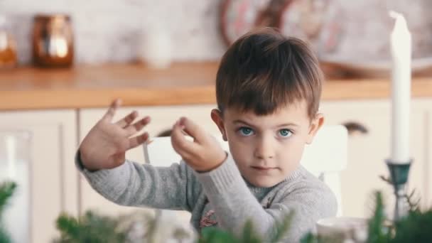 cute little boy waving hand and smile, close up - Кадри, відео