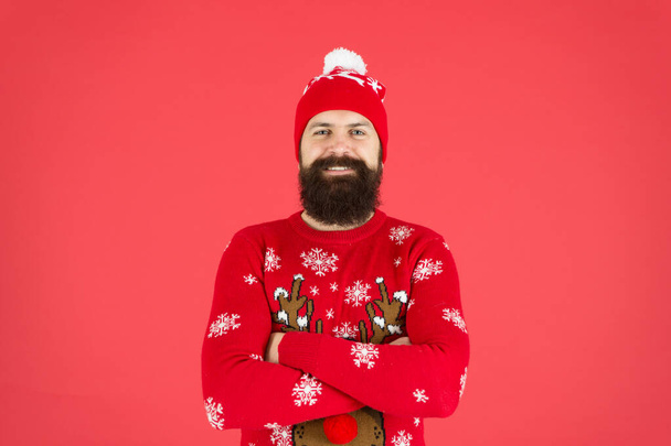 Winter bucket list. Hipster bearded man wear winter sweater and hat red background. Happy new year concept. Join holiday party. Christmas Sweater Party. Winter outfit. Good vibes. Fashion shop - Photo, Image