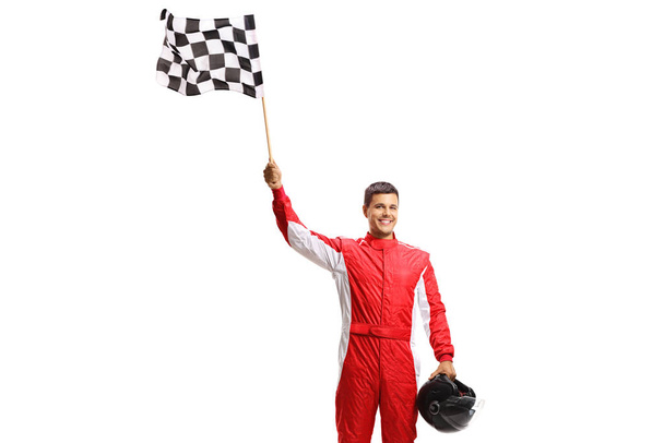 Formula holding a checkered flag and a helmet - Foto, afbeelding