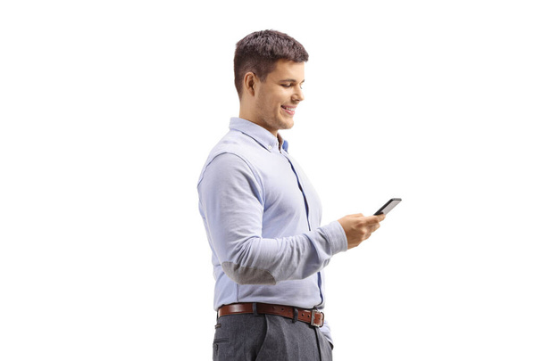 Young man in formal clotes using a mobile phone - Photo, Image