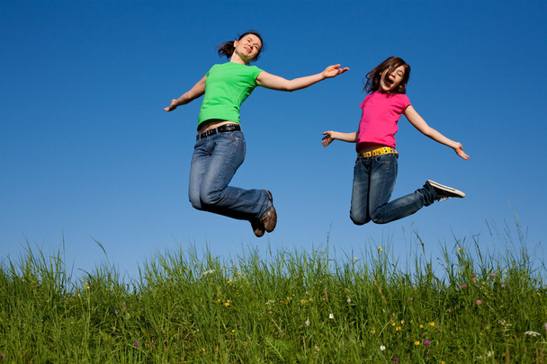 Girls jumping, running outdoor - Photo, image