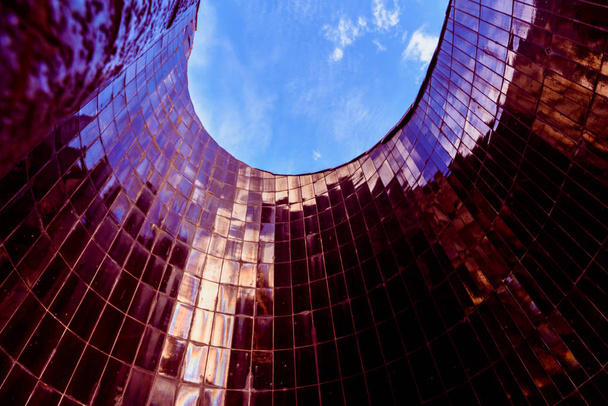 Conical smooth tile surface pointing to the blue sky with reflec - Photo, Image