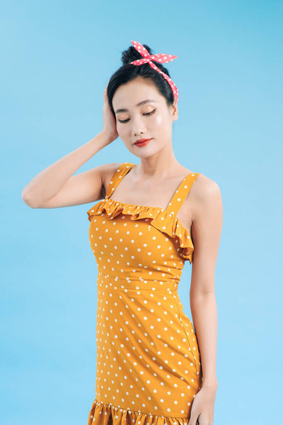 Asian model posing in retro fashion and vintage concept shoot. Copyspace area for advertising slogan or text message. - Foto, imagen