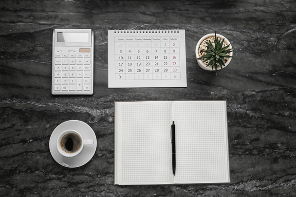 Flat lay composition with calendar on grey marble table - Photo, image