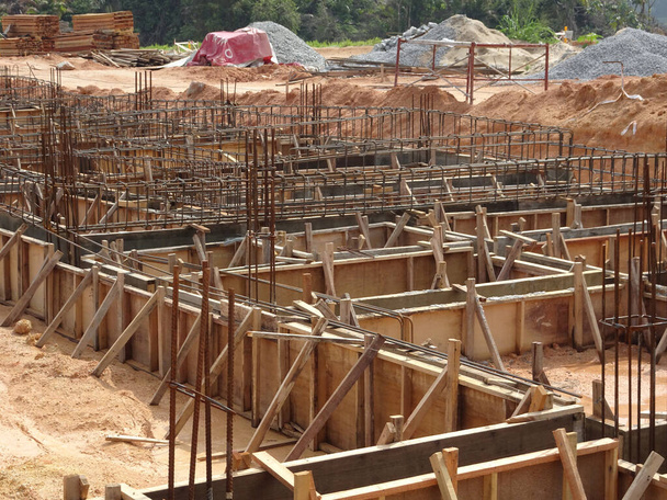 Building ground beam under construction using temporary timber plywood at the site. Reinforced by the reinforcement steel to strengthen the structure.    - Photo, Image