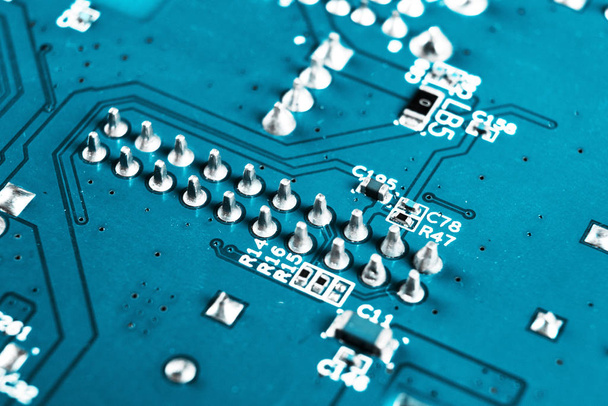 Macro shot of Circuit board with resistors microchips and electronic components. Computer hardware technology. Integrated communication processor. Information engineering. Semiconductor. PCB. Closeup - 写真・画像