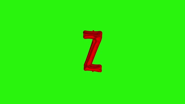 Vörös Z betű. Piros fólia hélium ballon ábécé lebeg a zöld képernyőn - Felvétel, videó