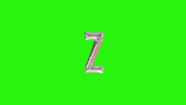 Zilveren letter Z. Zilverfolie helium ballon alfabet drijvend op groen scherm - Video