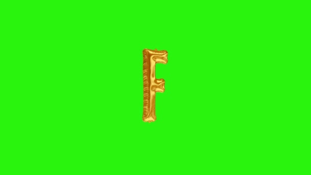 Lettre dorée F. alphabet de ballon d'hélium de feuille d'or flottant sur l'écran vert
 - Séquence, vidéo