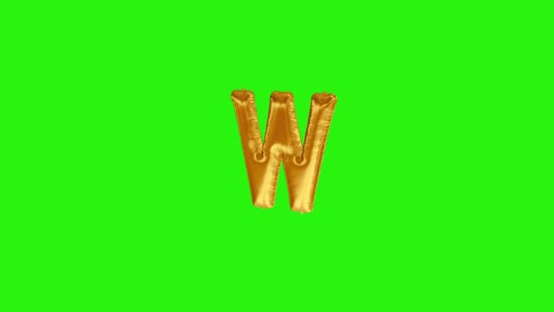 Arany betű W. Gold fólia hélium ballon ábécé lebeg a zöld képernyőn - Felvétel, videó