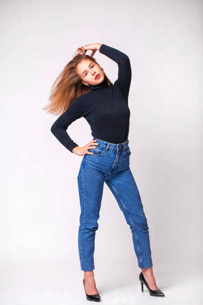 Beautiful girl in blue jeans - Valokuva, kuva