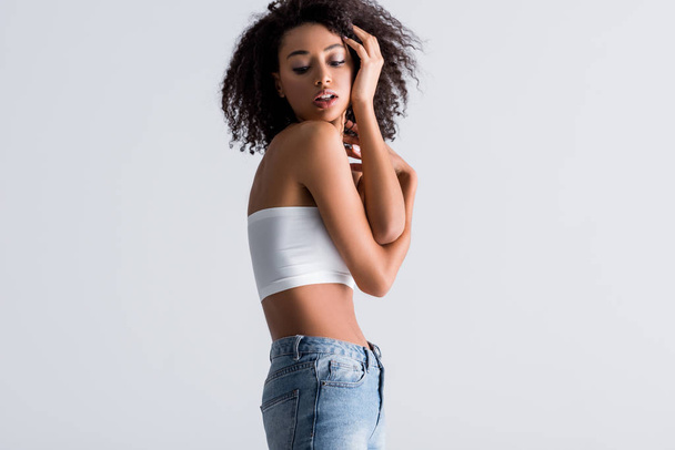 african american woman in white top isolated on grey - Foto, imagen