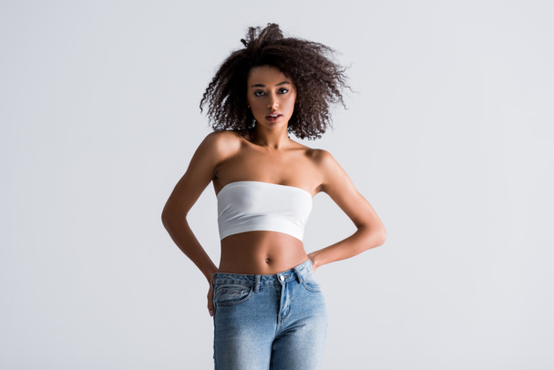 african american woman in white top isolated on grey - Foto, Imagen