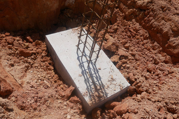 Casted pile cap at the construction site. It is part of the building foundation system. Protruded rebar is for the next stage of work. - Photo, Image