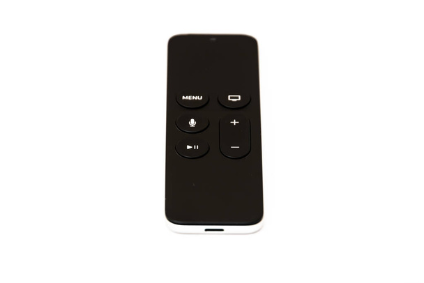 Simple and modern TV remote control with six buttons and touch surface - Photo, Image