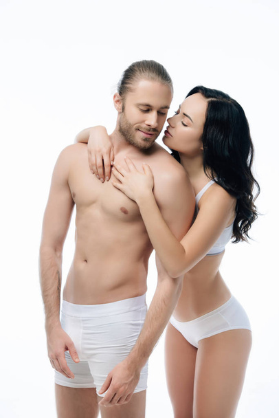 seductive couple hugging in white underwear, isolated on white - Photo, image