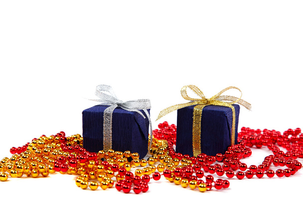 Package with gifts and Christmas ornaments isolated on a white b - Photo, Image