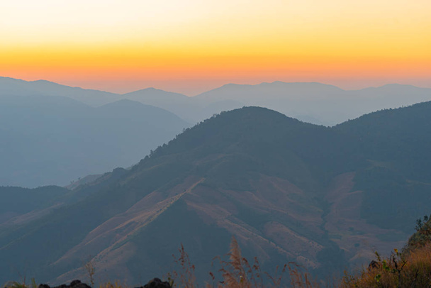 scenery sunrise above the mountain ridge on Doi Pha Phung at Nan province in Thailand. - Photo, Image