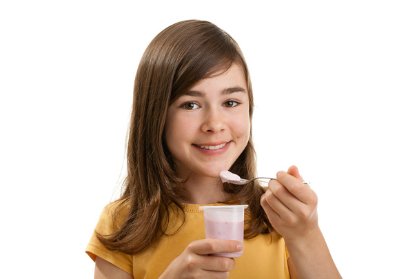 Girl eating yogurt - Valokuva, kuva