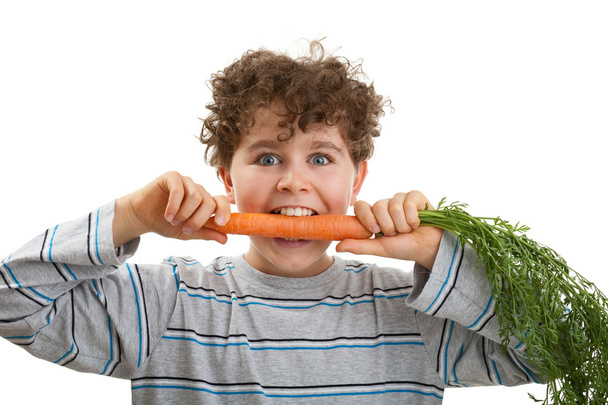 Boy holding fresh carrots - Photo, Image