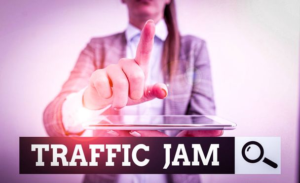 Writing note showing Traffic Jam. Business photo showcasing a large number of vehicles close together and unable to move Digital business concept with business woman. - Photo, Image