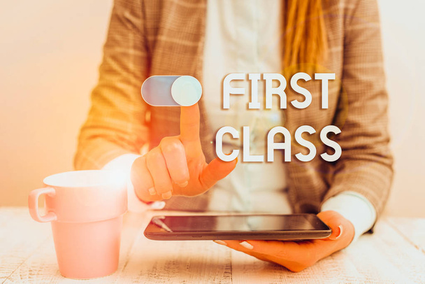 Text sign showing First Class. Business photo text the most expensive and most luxurious class of accommodation Business woman sitting with mobile phone and cup of coffee on the table - Photo, Image