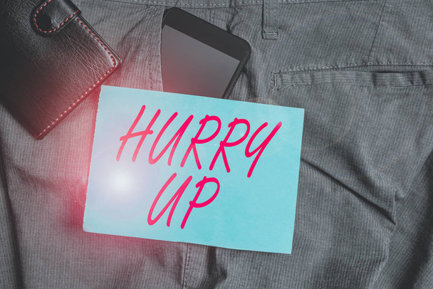 Conceptual hand writing showing Hurry Up. Concept meaning asking someone to do a job very fast Quickly Lets go Encourage Smartphone device inside trousers front pocket with wallet - Photo, Image